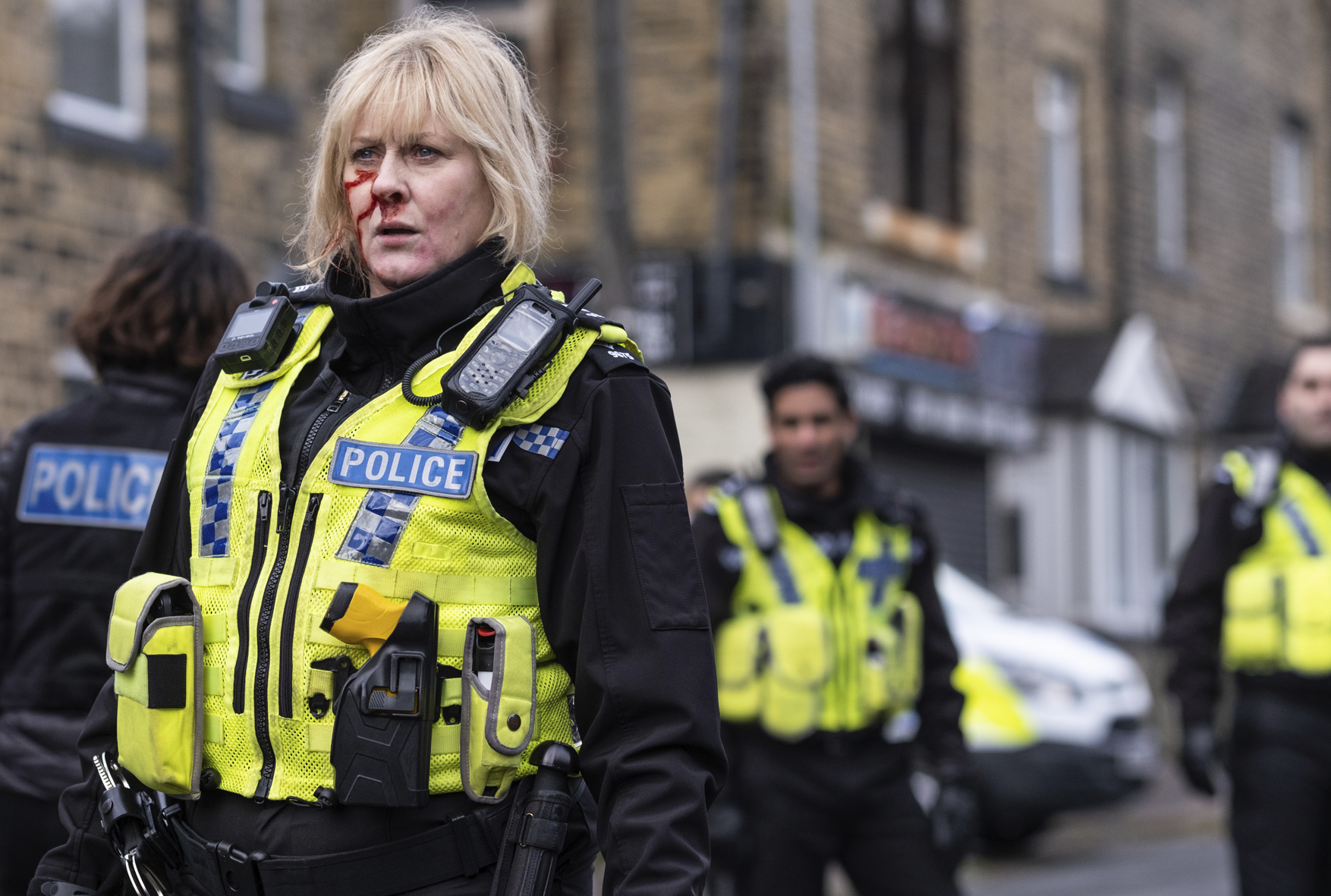 Sarah Lancashire as Catherine Cawood in police uniform with a bloody nose in Happy Valley series 3